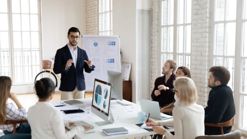 Leader in a work meeting taking charge